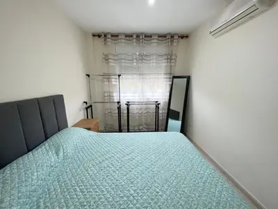 Cama o camas de una habitación en Camelia Apartment