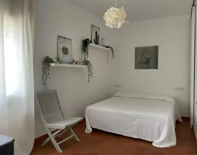 Cama o camas de una habitación en ESCAPADA