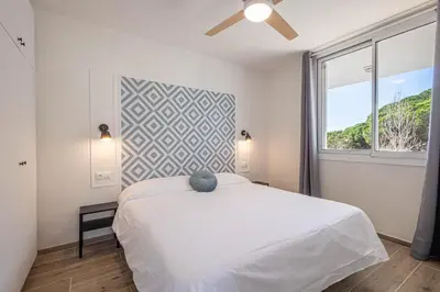 Cama o camas de una habitación en Hauzify I Apartaments Can Pi