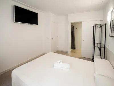 Cama o camas de una habitación en L'Hostalet GuestHouse