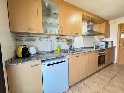 Una cocina o zona de cocina en RESIDENTIAL FLAT Lloret de Mar (Nex