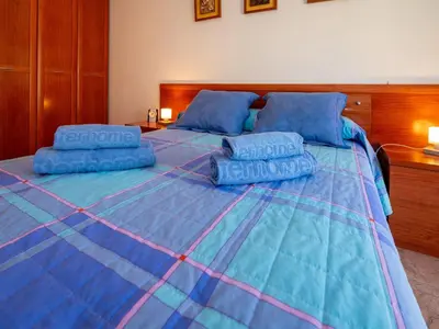 Cama o camas de una habitación en Apartment Colom by Interhome