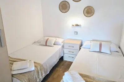 Cama o camas de una habitación en Apartamento Piscina en Platja d'Aro by Host&Joy