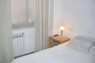 Cama o camas de una habitación en Charming Apartment in Palamós with Sea View and Terrace - 65 sqm