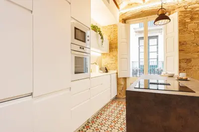 Una cocina o zona de cocina en Bravissimo Mercaders 3, Old Town Oasis