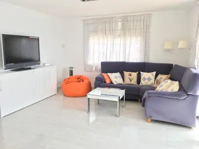 Una televisión o centro de entretenimiento en Aiguaneu Sa Marina