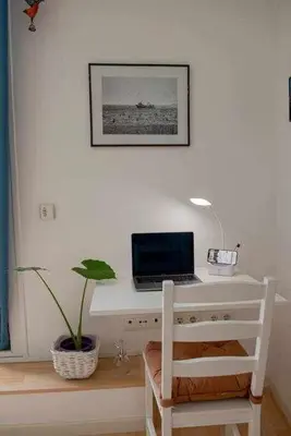 Una televisión o centro de entretenimiento en Apartamento céntrico con parking cerca de la playa