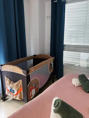 Cama o camas de una habitación en Apartamento céntrico con parking cerca de la playa