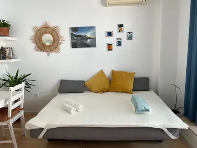 Cama o camas de una habitación en Apartamento céntrico con parking cerca de la playa