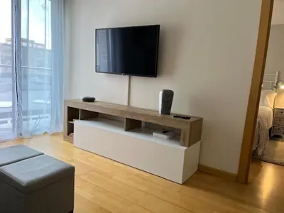 Una televisión o centro de entretenimiento en Apartamento céntrico con Parking en Palamos