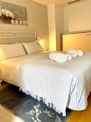 Cama o camas de una habitación en Apartamento céntrico con Parking en Palamos