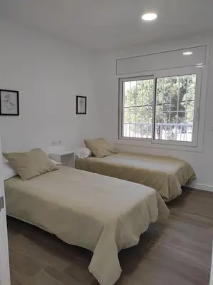 Cama o camas de una habitación en Apartamento Reformado con Aparcamiento. Playa 5min a pie.