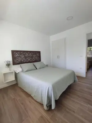 Cama o camas de una habitación en Apartamento Reformado con Aparcamiento. Playa 5min a pie.