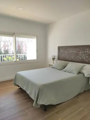 Cama o camas de una habitación en Apartamento Reformado con Aparcamiento. Playa 5min a pie.