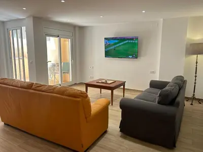Una televisión o centro de entretenimiento en APARTAMENTO EN LA PLAYA