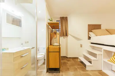 Cama o camas de una habitación en Bravissimo Mercadal, Monthly Apartment