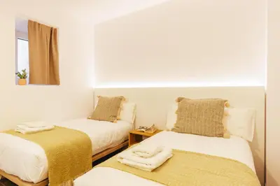 Cama o camas de una habitación en Bravissimo Mercadal, one-bedroom plus sofa bed