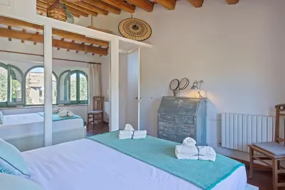 Cama o camas de una habitación en Encantadora casa en Peratallada