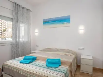 Cama o camas de una habitación en Apartamento a 50m de la playa