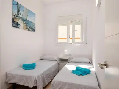 Cama o camas de una habitación en Apartamento a 50m de la playa
