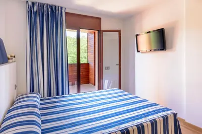 Cama o camas de una habitación en Apartamentos Tossa Dreams by Pandora Hoteles