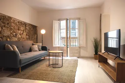 Una televisión o centro de entretenimiento en Elena Apartments Girona