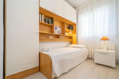 Cama o camas de una habitación en HomeHolidaysRentals Bluemar-Costa Barcelona