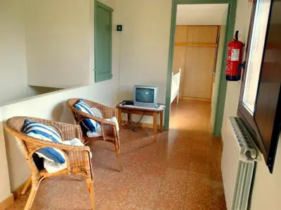 Una televisión o centro de entretenimiento en Can Jep Llarg Casa Rural