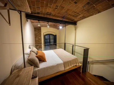 Cama o camas de una habitación en dúplex st Pere OnyarapartamentsCom