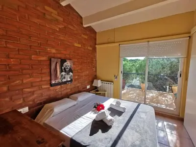 Cama o camas de una habitación en Villa élégante à Platja d'Aro près de la plage, climatisée avec terrasse et proche des boutiques et restaurants - ES-209-35