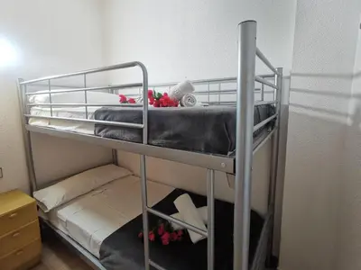Litera o literas de una habitación en Apartamento en el Centro de Platja d'Aro con Piscina, Terraza y Cerca de la Playa - ES-209-45