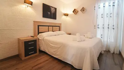 Cama o camas de una habitación en SeaHomes Vacations - CORAL SUN in Fenals Beach