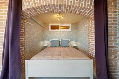 Cama o camas de una habitación en Hauzify I Apartament Plenamar