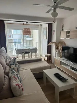 Una televisión o centro de entretenimiento en Apartamento Primera Línea de Mar