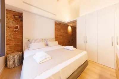 Cama o camas de una habitación en Bravissimo Ballesteries Penthouse, Monthly Apartment