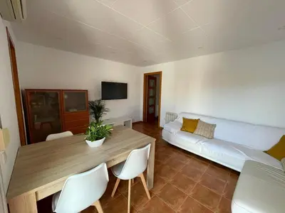 Una televisión o centro de entretenimiento en Apartamento céntrico cerca de la playa