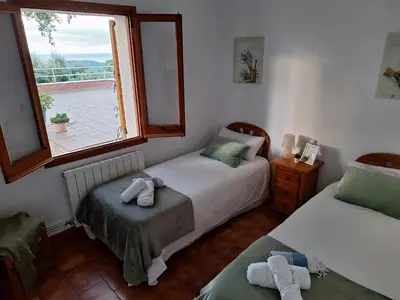 Cama o camas de una habitación en Casa Roure-4BR-Piscina privada-BBQ-Vistas Mar