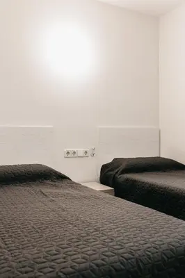 Cama o camas de una habitación en Hauzify I Apartament Arroyo