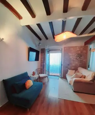 Zona de estar de Bonito estudio en el centro. Ideal parejas.