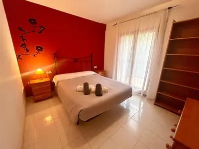Cama o camas de una habitación en Gran casa per a families a 5 minuts de la platja