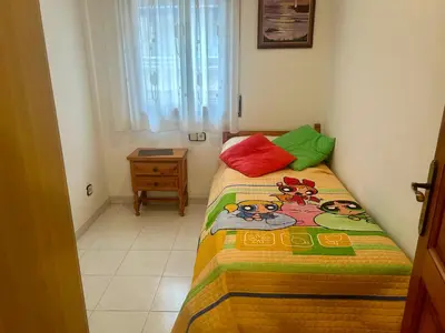 Cama o camas de una habitación en Gran casa per a families a 5 minuts de la platja
