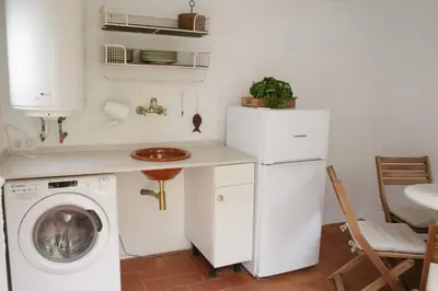 Una cocina o zona de cocina en CA LA NONA Centro de Palamós A 100 m de la playa Parking incluido