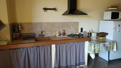 Una cocina o zona de cocina en CAN PLANAS , Estudio Familiar