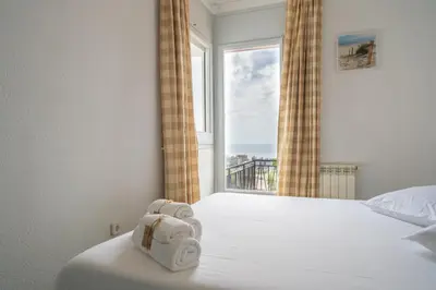 Cama o camas de una habitación en HomeHolidaysRentals Himalaia - Costa Barcelona