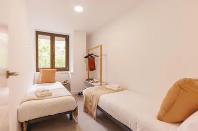Cama o camas de una habitación en Bravissimo Turbau Entresol A, with 3 bedrooms
