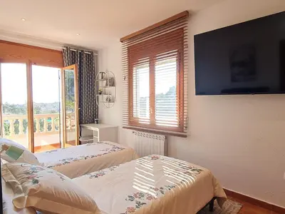 Cama o camas de una habitación en VILLA ARBUCIES with private pool