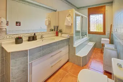 Un baño de VILLA ARBUCIES with private pool