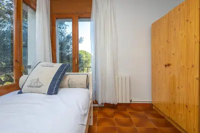 Cama o camas de una habitación en Acogedora casa con piscina en Sant Antoni Calonge