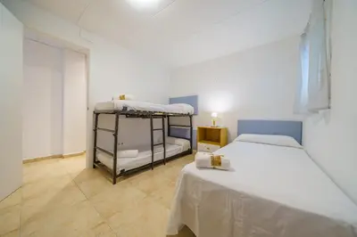 Cama o camas de una habitación en HomeHolidaysRentals Anais - Costa Barcelona