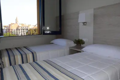 Cama o camas de una habitación en Apartaments la Catifa now with ELEVATOR!!!